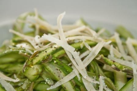 Raw Asparagus Salad topped with Parmesan