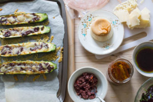 Olive and Fontina Baked Courgettes close up with antipasti
