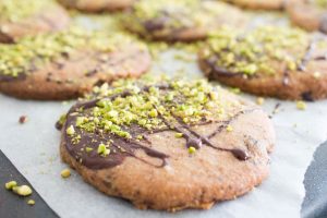 Decorating chocolate pistachio biscuits