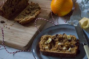 Mince pie fruit loaf spread with butter