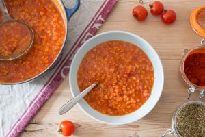 red lentil and tomato soup served in bowl